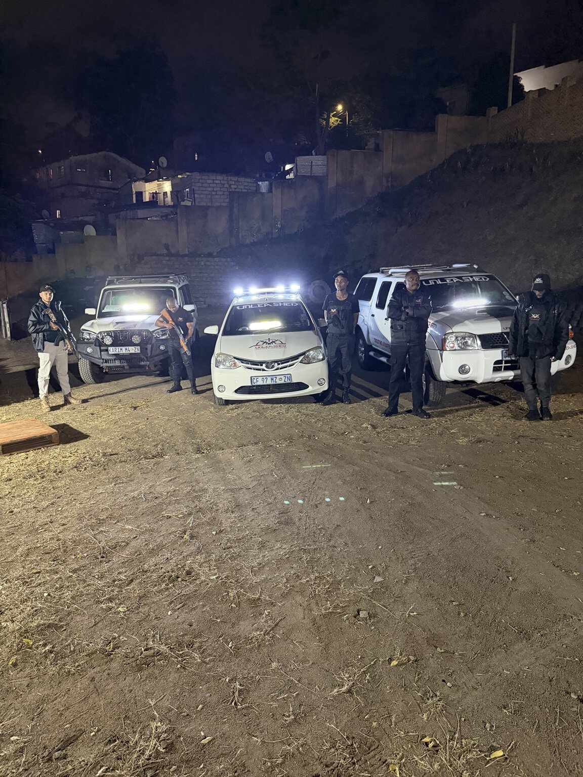 Unleashed Security tactical team with response vehicles at night